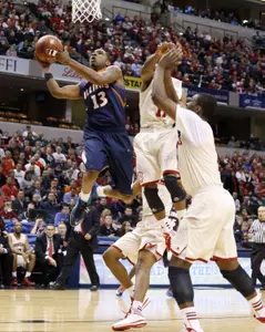 Illinois Fighting Illini guard Tracy Abrams (13) takes a shot against Indiana Hoosiers forward Noah Vonleh (1) in the first round of the Big Ten college basketball tournament at Bankers Life Fieldhouse. Mandatory Credit: Brian Spurlock-USA TODAY Sports