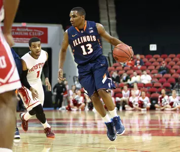 Tracy Abrams #13 of the Illinois Fighting Illini controls the ball during the NIT First Round game at Agganis Arena on March 19, 2014 in Boston, Massachusetts . (Photo by Elan Kawesch) Tracy Abrams (13)