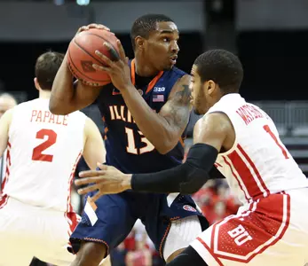 Tracy Abrams #13 of the Illinois Fighting Illini keeps the ball from Maurice Watson Jr. #1 of the Boston University Terriers during the NIT First Round game at Agganis Arena on March 19, 2014 in Boston, Massachusetts . (Photo by Elan Kawesch)