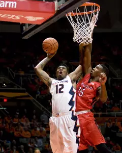 Illinois Fighting Illini forward Leron Black (12) shoots defended by Rutgers Scarlet Knights guard Jake Dadika (15) at State Farm Center. Credit: USA Today