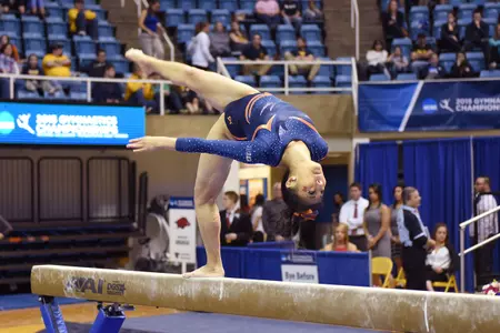 Sunny Kato on beam at the NCAA Morgantown Regional