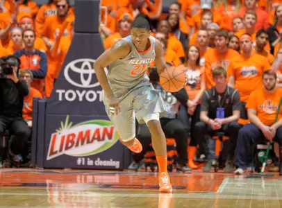 Malcolm Hill drives the ball up the court against Northwestern.