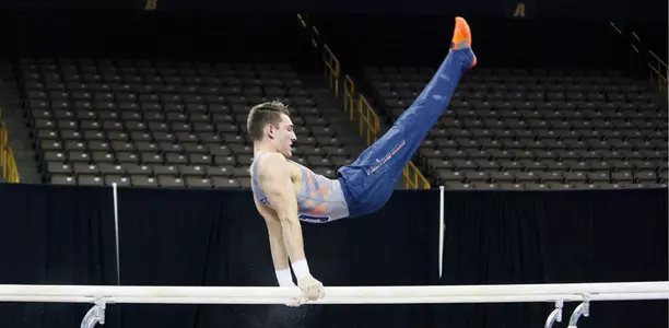 Matt Foster on parallel bars at Iowa