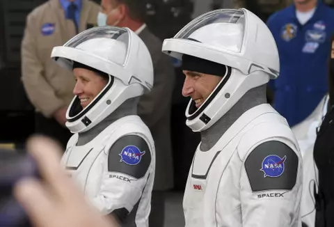 Nov 15, 2020; Kennedy Space Center, FL, USA; SpaceX Crew-1 astronauts Shannon Walker, and Michael Hopkins stand before family and coworkers before heading to the launch pad Sunday, November 15, 2020. They will join Japanese astronaut Soichi Noguchi and Victor Glover aboard a Falcon 9 rocket headed to the International Space Station. Mandatory Credit: Craig Bailey-USA TODAY NETWORK