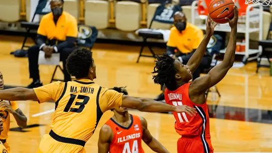Dec 12, 2020; Columbia, Missouri, USA; Illinois Fighting Illini guard Ayo Dosunmu (11) shoots a layup against Missouri Tigers guard Mark Smith (13) and guard Dru Smith (12) and guard Xavier Pinson (1) during the first half at Mizzou Arena. Mandatory Credit: Jay Biggerstaff-USA TODAY Sports