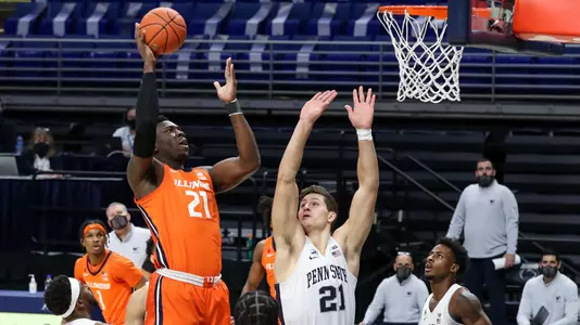 Dec 23, 2020; University Park, Pennsylvania, USA; Illinois Fighting Illini center Kofi Cockburn (21) drives the ball to the basket as Penn State Nittany Lions forward John Harrar (21) defends during the first half at Bryce Jordan Center. Mandatory Credit: Matthew OHaren-USA TODAY Sports
