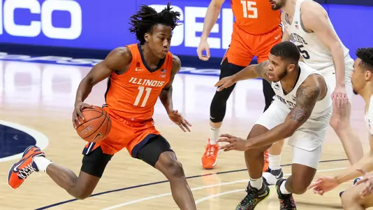 Dec 23, 2020; University Park, Pennsylvania, USA; Illinois Fighting Illini guard Ayo Dosunmu (11) dribbles the ball as Penn State Nittany Lions guard Myles Dread (2) defends during the first half at Bryce Jordan Center. Mandatory Credit: Matthew OHaren-USA TODAY Sports