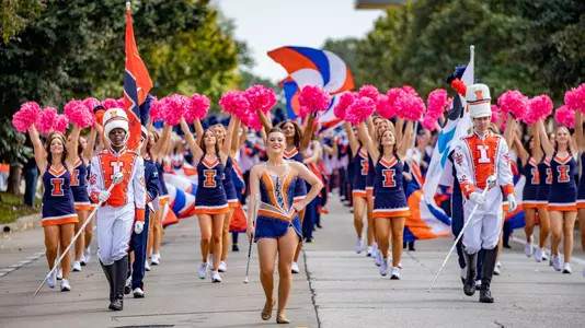 The University of Illinois Urbana-Champaign 2021 Homecoming Parade draws the Illini faithful as they come to watch the Marching Illini, Illinois Alumni Band, Grand Marshal Mary Henson, as well as student organizations and community participants.