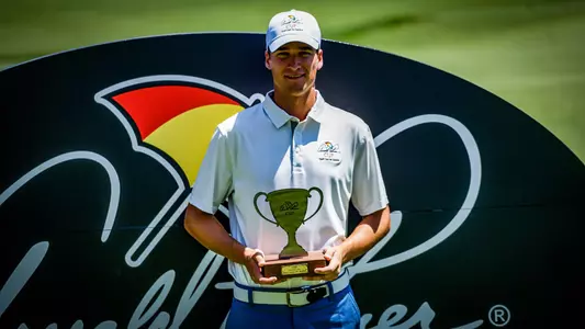 Adrien Dumont de Chassart with 2022 Arnold Palmer Cup trophy
