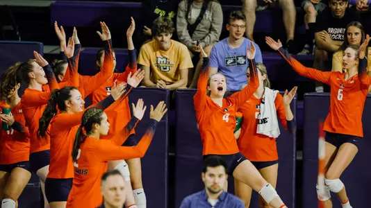 team bench celebration at Marquette