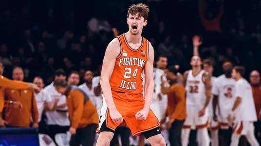 NEW YORK, NEW YORK - DECEMBER 06: Matthew Mayer #24 of the Illinois Fighting Illini reacts after making a three pointer during the second half of the game against the Texas Longhorns at Madison Square Garden on December 06, 2022 in New York City. (Photo by Dustin Satloff/Getty Images)