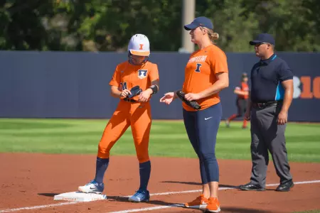 CHAMPAIGN, IL - September 30, 2023 - Illinois Outfielder Stevie Meade (#24), Illinois Assistant Coach Sydney Sickels during the game between the Huskies and the Illinois Fighting Illini at Eichelberger Field in Champaign, IL. Photo By Richard Lu