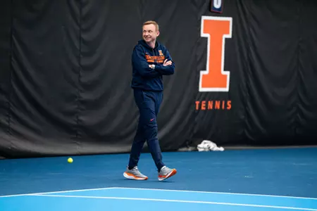 URBANA, IL - February 17, 2024 - Illinois Head Coach Evan Clark during the match between the Brown Bears and the Illinois Fighting Illini at Atkins Tennis Center in Urbana, IL. Photo By Kevin Snyder