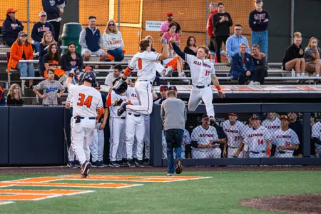 CHAMPAIGN, IL - February 27, 2024 - Illinois Catcher Jacob Schroeder (#8) and Illinois Catcher Camden Janik (#17) during the game between the Eastern Illinois Panthers and the Illinois Fighting Illini at Illinois Field in Champaign, IL. Photo By Kevin Snyder