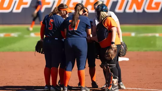 Softball huddles in the circle
