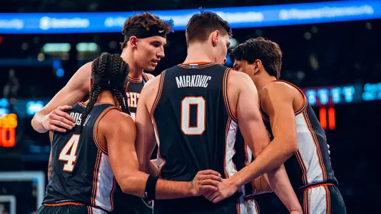 Team huddle vs. #5 UConn at Madison Square Garden_11-28-25 (Courtney Bay)