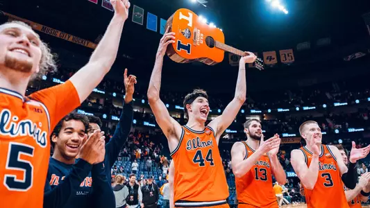 Team celebration vs. #13 Tennessee 12/6/25 (Courtney Bay)