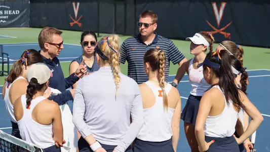 Team huddle NCAA Tournament Evan Clark Jacob Eddins Kate Duong