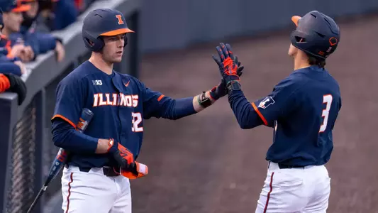 CHAMPAIGN, IL - February 25, 2026 - Infielder Kyle Schupmann (#32), Infielder Michael Farina (#3) during the game between the Lindenwood Lions and the Illinois Fighting Illini at Illinois Field in Champaign, IL. Photo By Ashley Ray/Fighting Illini
