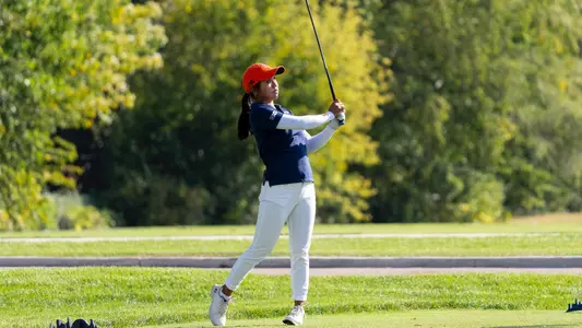 Brielle Mapanao watches the ball after swinging