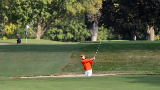 Victoria Zheng hits out of a bunker