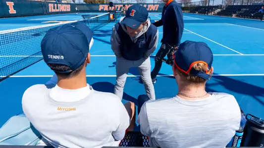 CHAMPAIGN, IL - April 05, 2026 - Assistant Coach Tim Kopinski during the match between the Purdue Boilermakers and the Illinois Fighting Illini at Atkins Tennis Center in Champaign, IL. Photo By Knox Mynatt/Fighting Illini