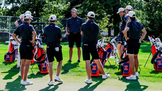 Men's golf team huddle