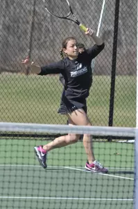 Tennis player Amanda Pitocco swings her racket during a match.