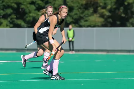 Field Hockey forward Adrienne Houle is pictured during gameplay looking up field at Lennon Family Field.