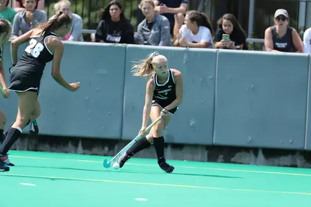 Sylvia Miller dribbles the ball on offense during a field hockey game at Lennon Family Field