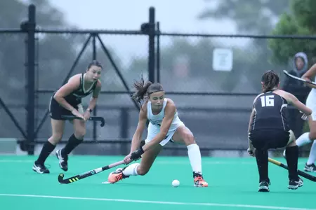 Field Hockey forward Izzy Mendez winds up to send the ball across the turf during a game verses Bryant.