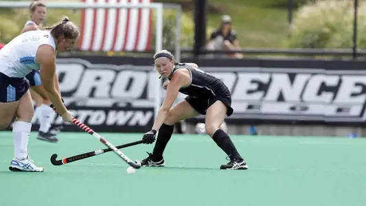 Field Hockey forward Kara Sanford attempts to defend and intercept the ball from a Maine defender during their game at Lennon Family Field.