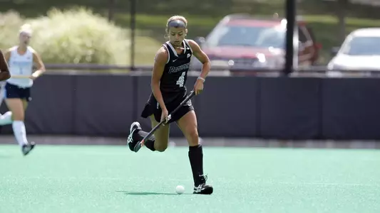 Field Hockey forward Izzy Mendez runs up the field with possession of the ball during a game at Lennon Family Field.