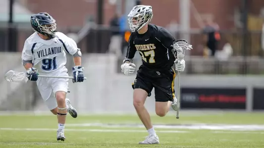 Ryan Nawrocki cradling down the field with opponent close by in 2020 game versus Villanova. Picture taken by Stew Milne