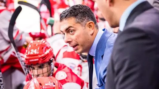 Photo of Rico Blasi coaching behind the bench