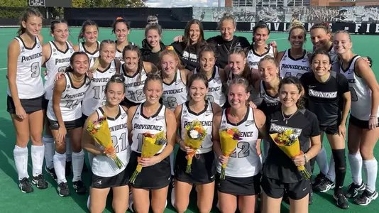 Field Hockey Senior Day photo of the Class of 2022, taken on Lennon Family Field before their game.