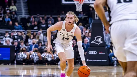 Noah Horchler dribbles to basket.