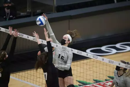 Deneliak spiking the ball during the 2020-21 season