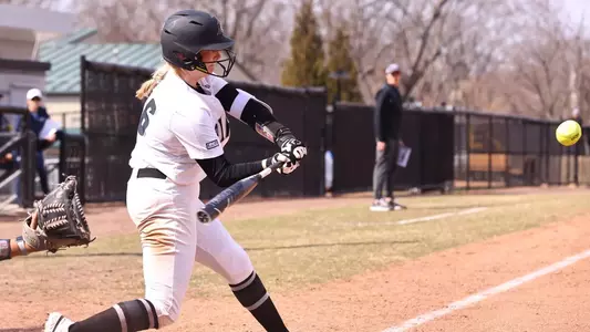 Jacque Harrington in the middle of hitting during one of the softball games in 2022.