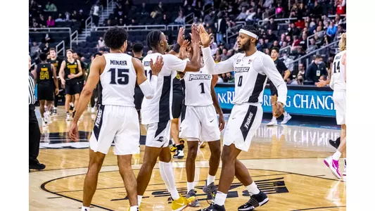 Friar Men's Basketball Players Celebrate after a game