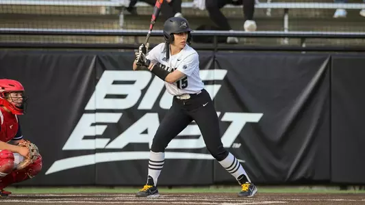 Madi Traver getting ready to hit the softball at a game.