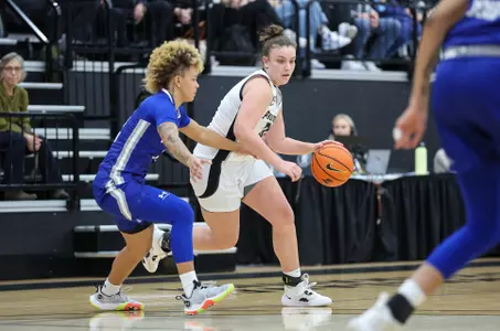 Meghan Huerter dribbles the ball vs a Seton Hall defender