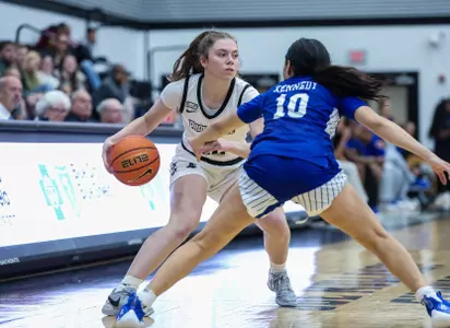 Bella McLaughlin sets up a play in a game against Hampton