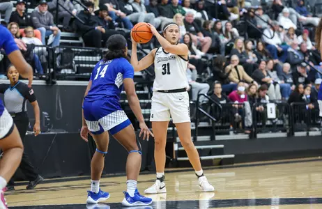 Olivia Olsen looks to pass in a game vs. Hampton