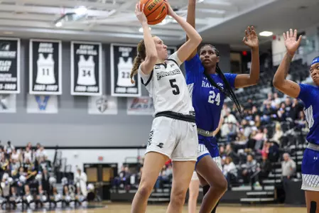 Sophi Hall looks to score in a women's basketball game vs. Hampton