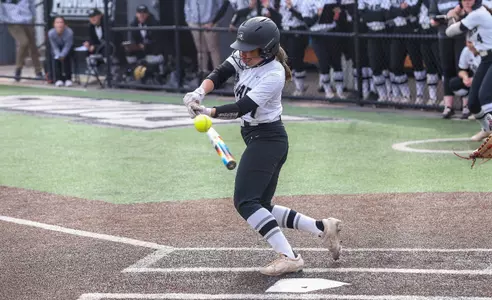 Elisa Smith hitting in softball game.