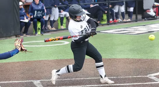 Ryanne Haynes hitting in softball game.