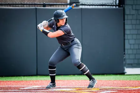 Sofia Peterson hitting in softball game