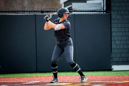 Jacque Harrington hitting in softball game.