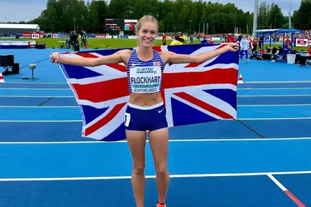 Shannon Flockhart posing with the flag of Great Britain at the Women's Track at European U23 Championships